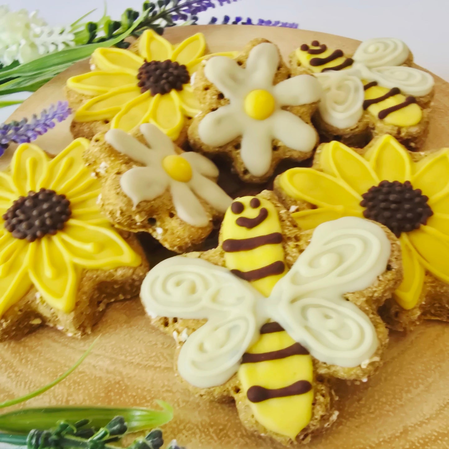 Decorative sandal with yellow flowers, bees, and lavender on a white background