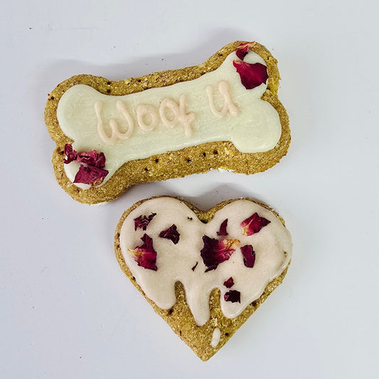 Two bone-shaped dog treats with visible branding on a white background